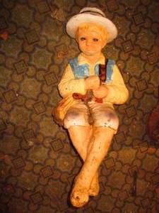 Large, near life sized boy fishing...