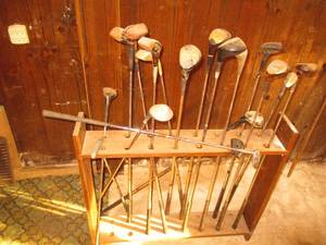 Long narrow wooden framed golf club...