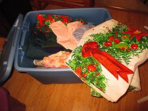 Blue covered storage tote filled wi...