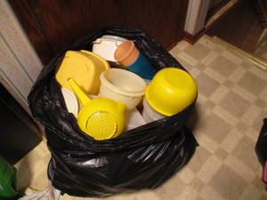 Huge garbage bag filled with assort...