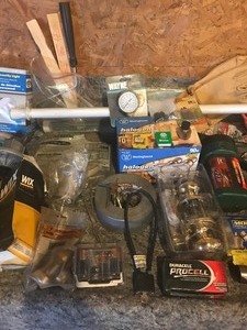 lot 115 image: Flashlights, locks, batteries, paint rollers, knife sharpeners, door knob assembly and more