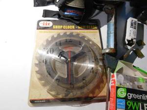 lot 22 image: Welding helmet, saw blade clock, air stapler w staples and more
