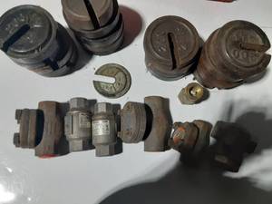 lot 214 image: Coca cola crateof cast iron weights and plumbing parts
