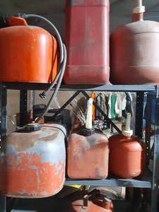 lot 158 image: 2 boat gas tanks and 8 gas cans