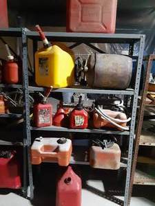 lot 157 image: 3 boat gas tanks and 7 gas cans