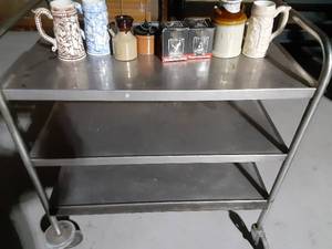 lot 154 image: Metal serving cart and black velvet glasses, steins and more