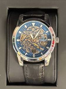 lot 36 image: New Talis Co. Skeleton Dial Watch  $735 Retail
