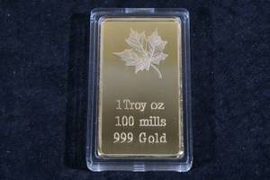 lot 76 image: Novelty 100 mills GOLD PLATED Bar