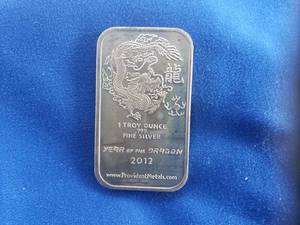 lot 18 image: 1 Troy Ounce .999 Fine Silver Year of the Dragon 2012