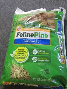 lot 211 image: 20 pounds of feline pine cat litter...