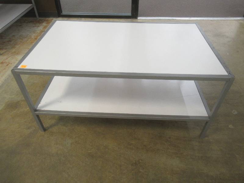 lot 310 image: 2-Tier Display Table With Steel Frame, Approximate Dimensions 48 x 30 x 23 Tall. Slight Scratch and Dent.
