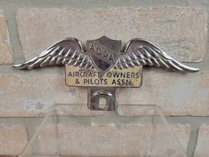 lot 199 image: Vintage Metal AOPA License Plate Topper - Aircraft Owners & Pilots Association - Approx. 8 Wide
