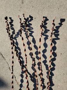 lot 23 image: Tall Swirling Iron Ribbon Yard Art, set of 6