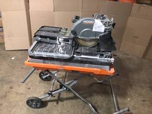 lot 6 image: Ridgid 10 in. Wet Tile Saw with Folding Stand open box customer return see pictures