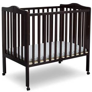 lot 169 image: Brand New  Delta Children Folding Portable Crib - Dark Chocolate
