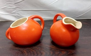 lot 89 image: Vintage Orange Creamer And Sugar Set