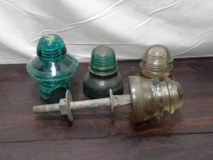 lot 100 image: Four Large Glass Insulators