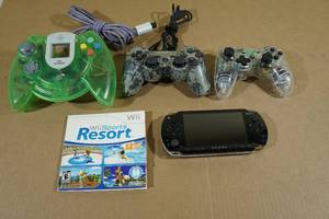 lot 33 image: Assorted Gaming -PSP, Wii Sports Resort, PS3 Controller, Dreamcast Controller