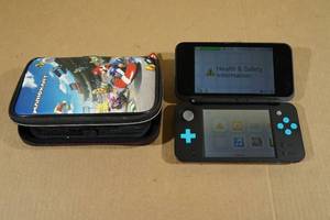lot 35 image: Nintendo New 2DS XL Game System with Case