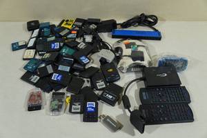 lot 51 image: Assorted PS2 Accessories -Remotes, Memory Cards
