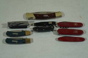 lot 107 image: Assorted Pocket Knives -Schrade, Swiss Army, Buck, Remington