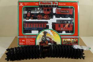 lot 114 image: New Bright Santa Fe Express Model Train Set with Extra Tracks -Works