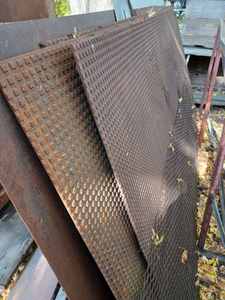 Four 4-foot X 8-foot Sheets of Iron with a Safety Grating Type of Surface, One 29-inch X 8-inch and More