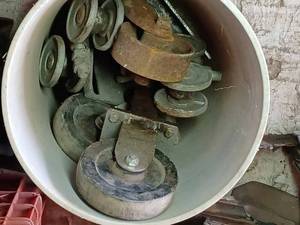 5-Gallon Pail Containing 4.5-inch Casters, 3-inch Sliding Door Caster, and a 4-inch Iron Caster