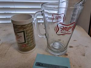 lot 1361 image: 9 Miller High Life Glass Pitcher with Plastic Mug