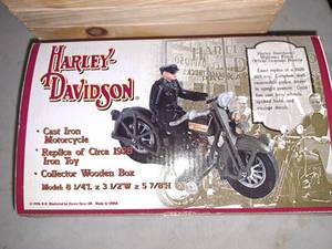 lot 1390 image: Harley Davidson Cast Iron Replica 1928 Iron Toy Highway Patrol Motorcycle (in original packaging)