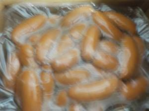 lot 303 image: 11 lb. Bag Frozen Knockwurst...