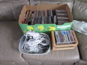 lot 320 image: Box of CDs and misc. electronics...