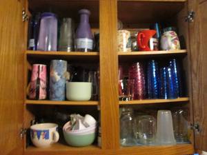 lot 380 image: Cupboard full of glasses mugs and m...