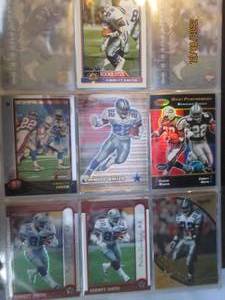 lot 651 image: Emitt Smith binder of football card...