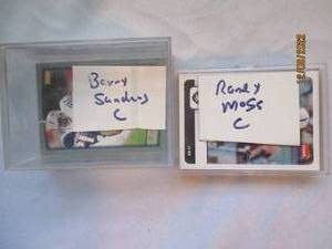 lot 668 image: Barry Sanders, Randy Moss football ...