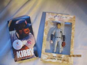 lot 769 image: Kirby and Elway VHS and Figurine...