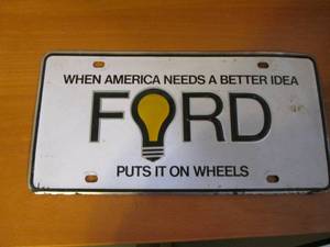 lot 456 image: Ford gold emblam license plate...