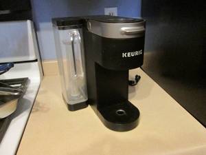 lot 395 image: Keurig. Black. Powers on....
