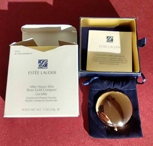 lot 96 image: Vintage Estee Lauder Lucidity Compact With Box, Paperwork, Etc