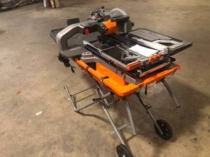 lot 1 image: Ridgid 15 Amp 10 in. Wet Tile Saw with Portable Stand OPEN BOX  customer return see pictures