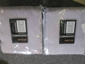 2 new sets of 95 inch  curtains...