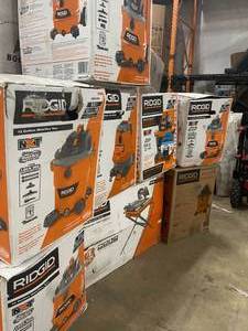 Pallet with assorted Ridgid Shop Vacs and Wet Tile Saw with Stand open box various conditions customer returns