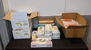 lot 51 image: Assortment of Commercial Grade Sysco Vinyl Gloves, Foil Sheets, Reynolds Foodservice Film, Plastic Bags, and Sticker Labels