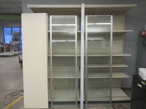 lot 200 image: Glass Display Case (Partially Disassembled) Glass Doors For Easy Viewing, Missing Key. In nice condition, Used in Retail Store - Must Disassemble, Bring Tools. Dimensions 96 x 28 12 x 96 Tall. SOLD AS IS.