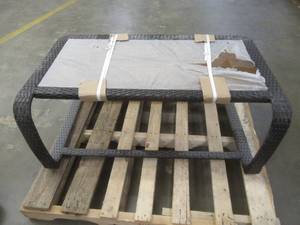 lot 202 image: RatanWicker Coffee Table With Amber Glass Top, 43 x 25 x 18 Tall. In nice condition, SOLD AS IS