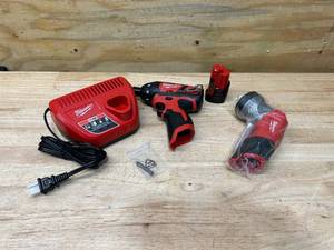 lot 24 image: MILWAUKEE M12 Screwdriver, LED Worklight, Battery, and Charger in Soft Case