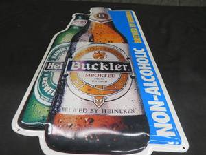 lot 36 image: METAL HEINEKEN  BUCKLER BEER SIGN