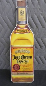 lot 37 image: METAL JOSE QUERVO BOTTLE