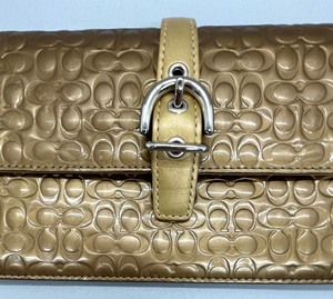 lot 4 image: Gold Metallic Clutch by Coach