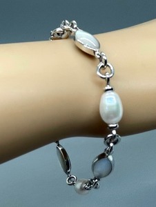 lot 83 image: Sterling Silver, Freshwater Pearl and Mother of Pearl Bracelet